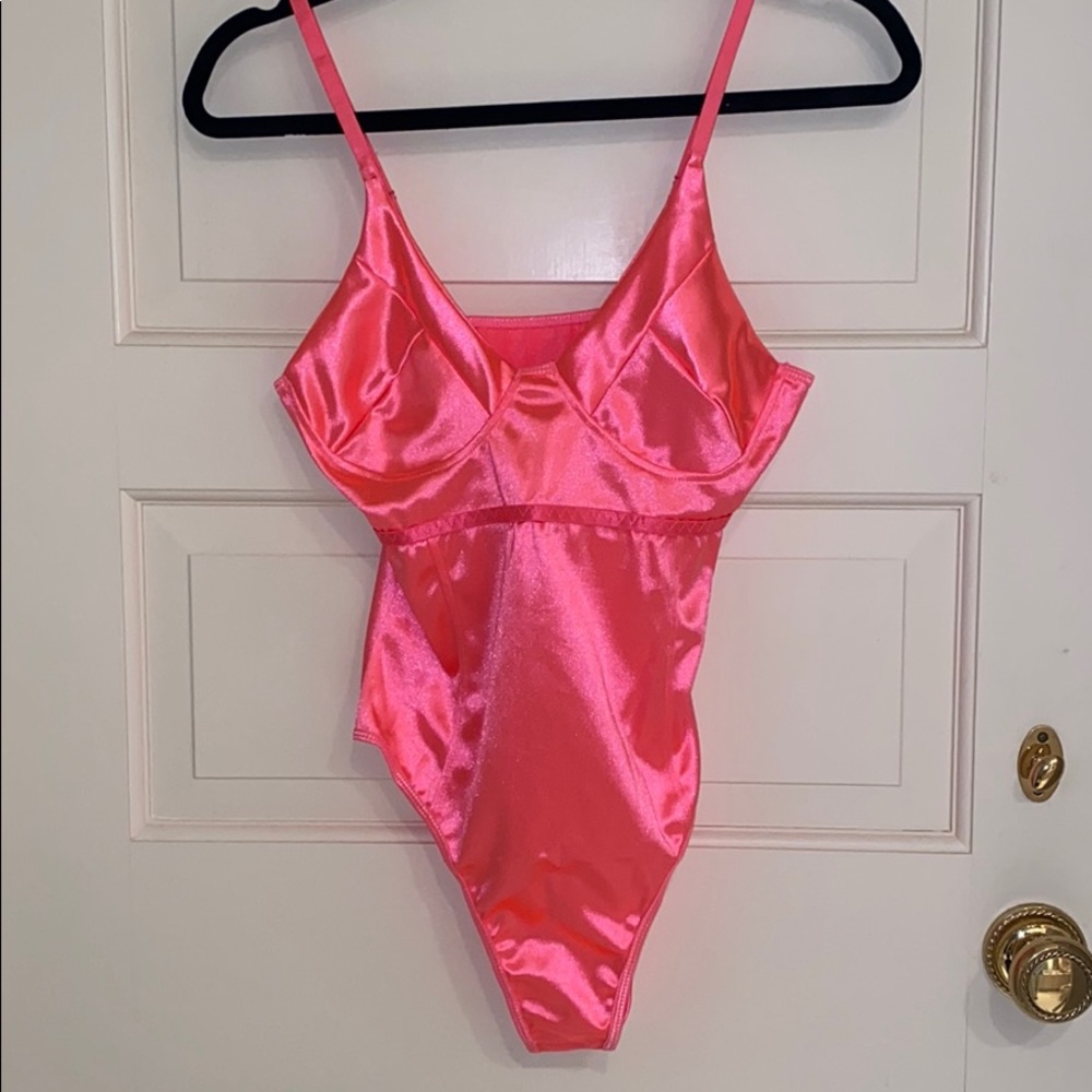 Hot pink body suit